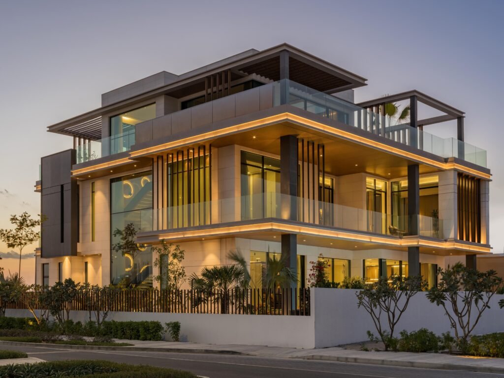 Street elevation at dusk showing the gated entrance, Harrisoni Villas, La Mer South, Jumeirah 1, Dubai