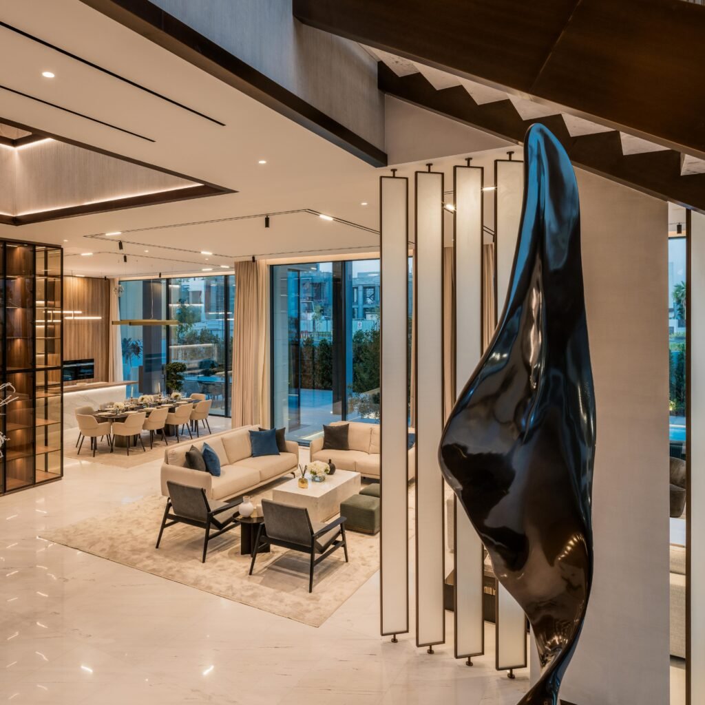 Living room with bronze sculpture and illuminated light columns, Harrisoni Villas, La Mer South, Jumeirah 1, Dubai