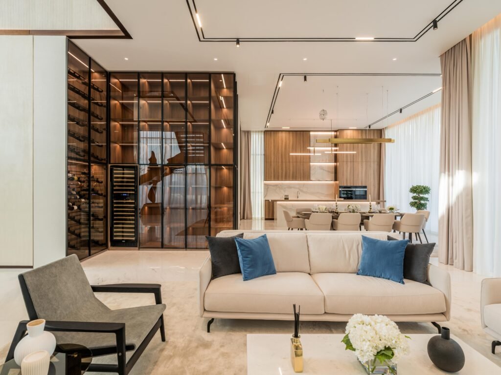 Open plan living and dining with wine wall and marble kitchen, Harrisoni Villas, La Mer South, Jumeirah 1, Dubai