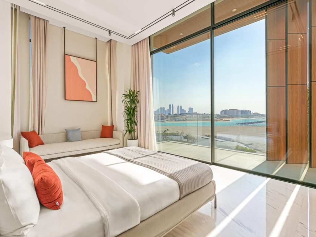 Bedroom with full height glazing facing open sea and the Dubai skyline, Harrisoni Villas, La Mer South, Jumeirah 1, Dubai