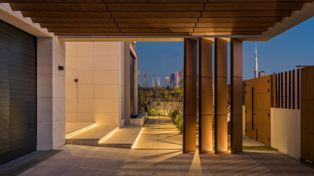 Entrance approach with the Burj Khalifa framed between timber fins, Harrisoni Villas, La Mer South, Jumeirah 1, Dubai