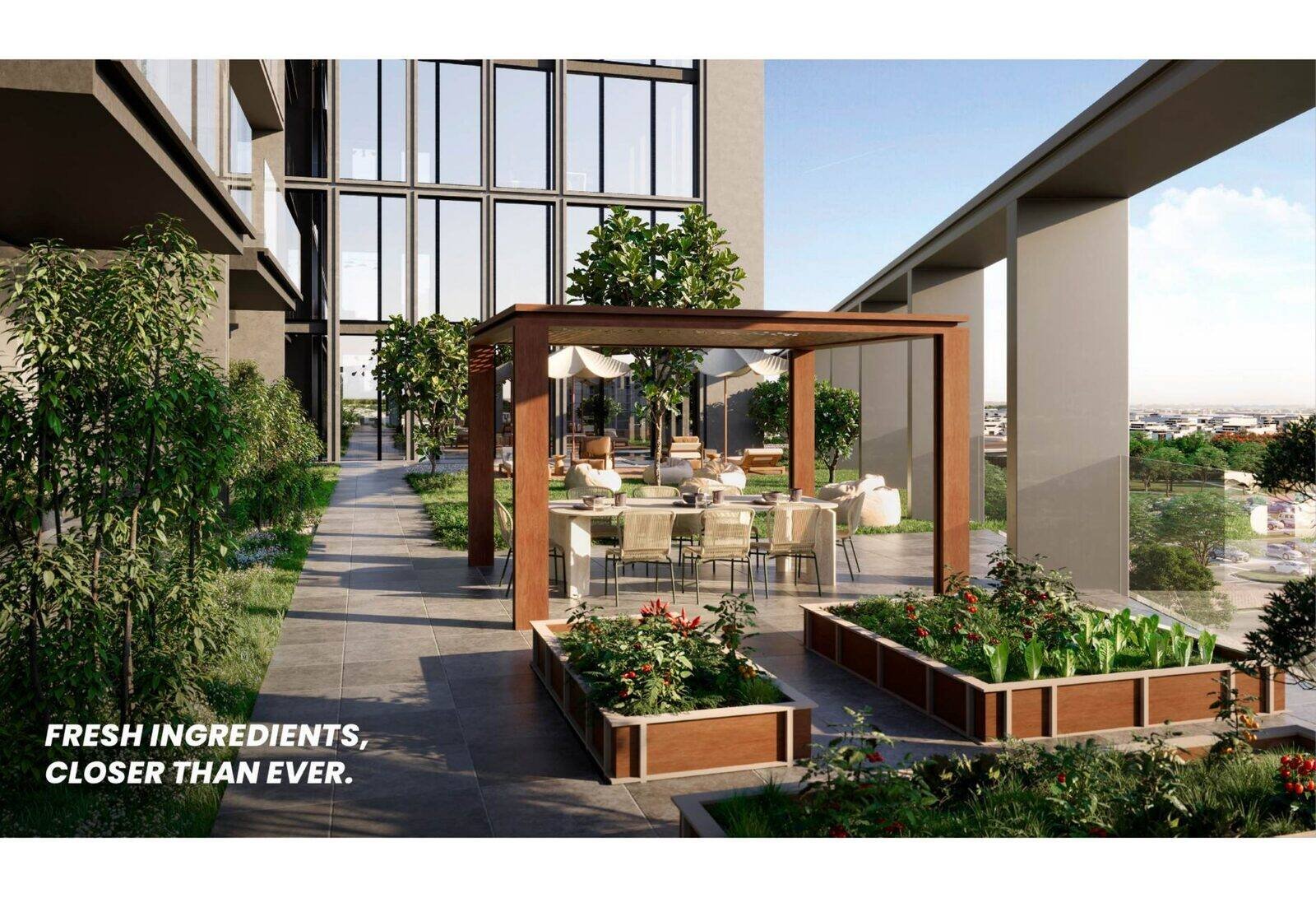 Edible Garden terrace at KORE by Imtiaz with raised planters and a shaded dining pergola